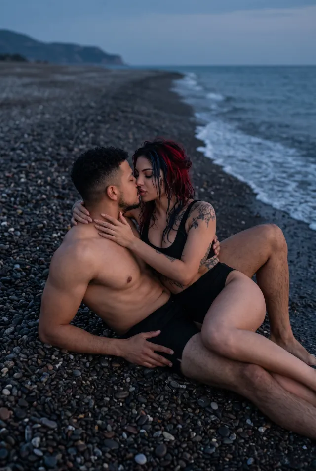 Beach at twilight – an intimate kiss by the water